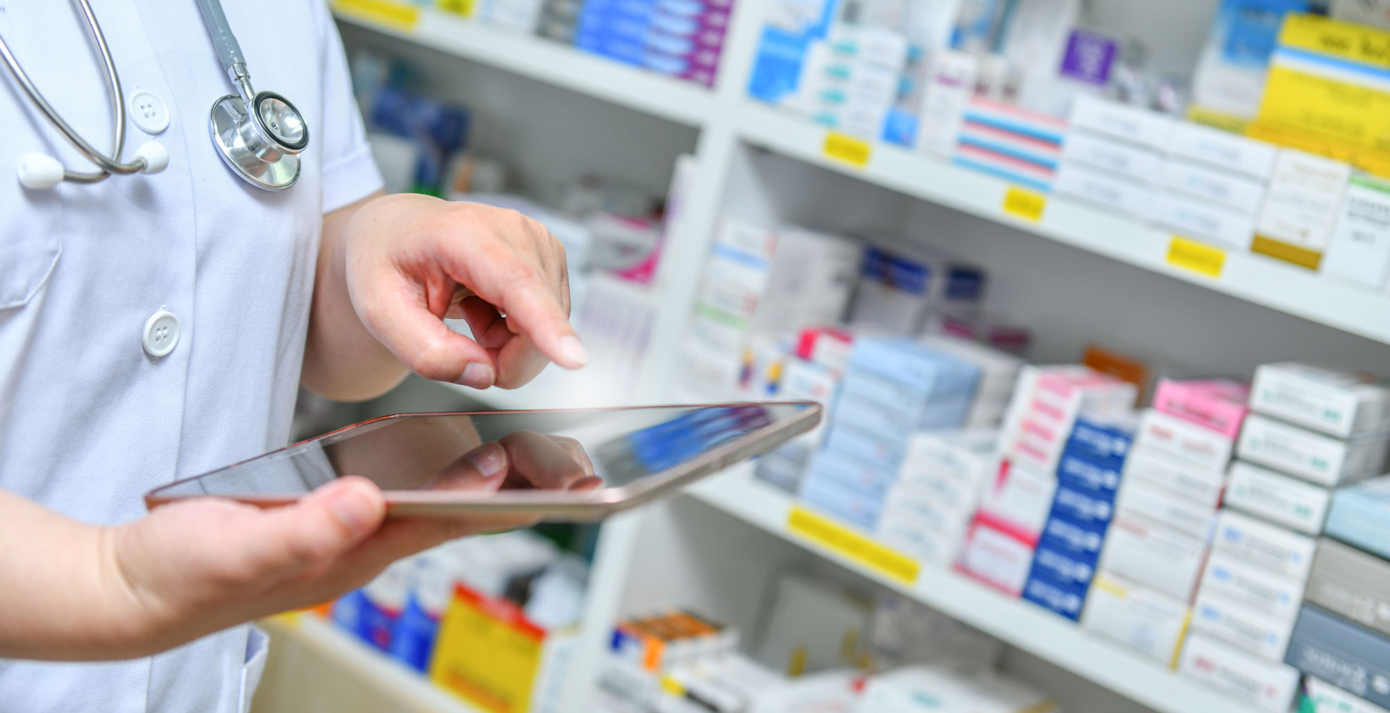 Person pointing at phone in a pharmaceutical office