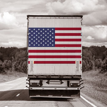 United States flag behind a truck